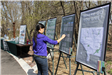 Young girl checks signs at event