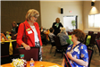 Commissioner Robyn West visits with RSVP event guest