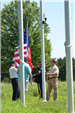 Veterans raise the flag