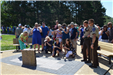 Service attendees admire the new plaque