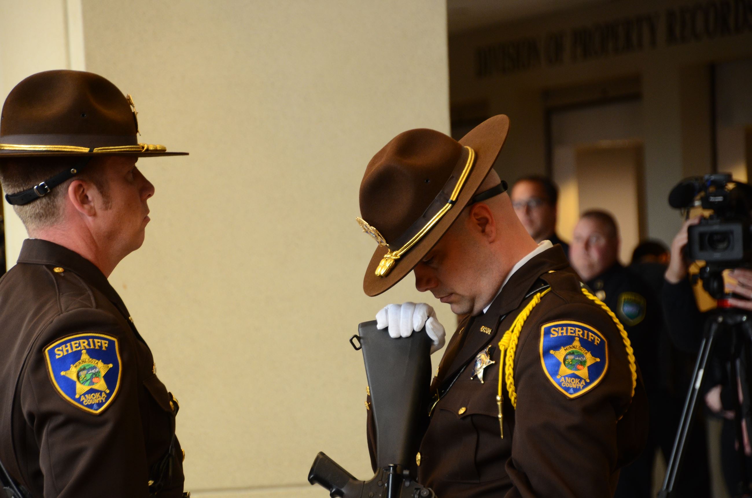 Officer inspects honor guard rifle