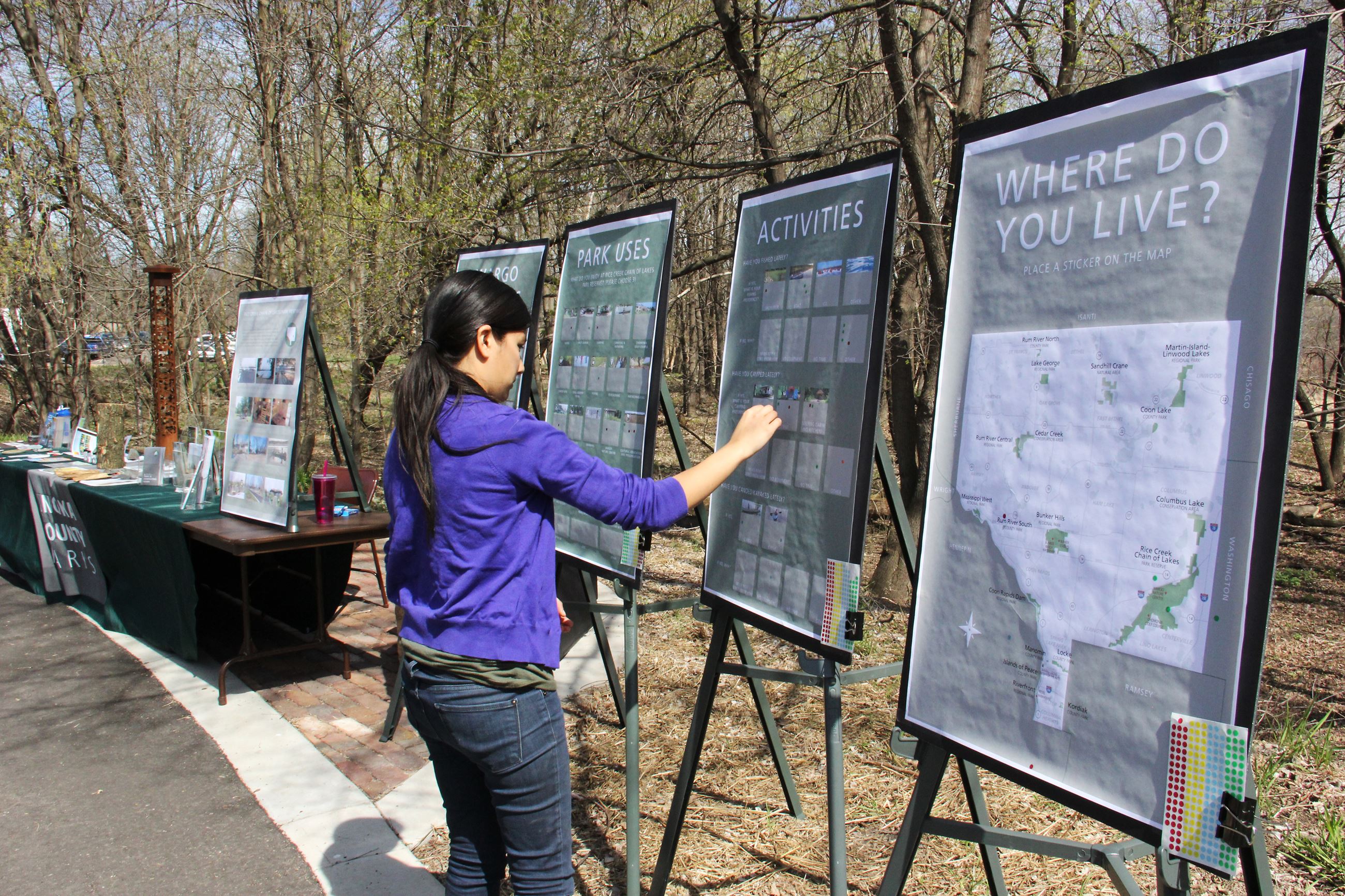 Young girl checks signs at event