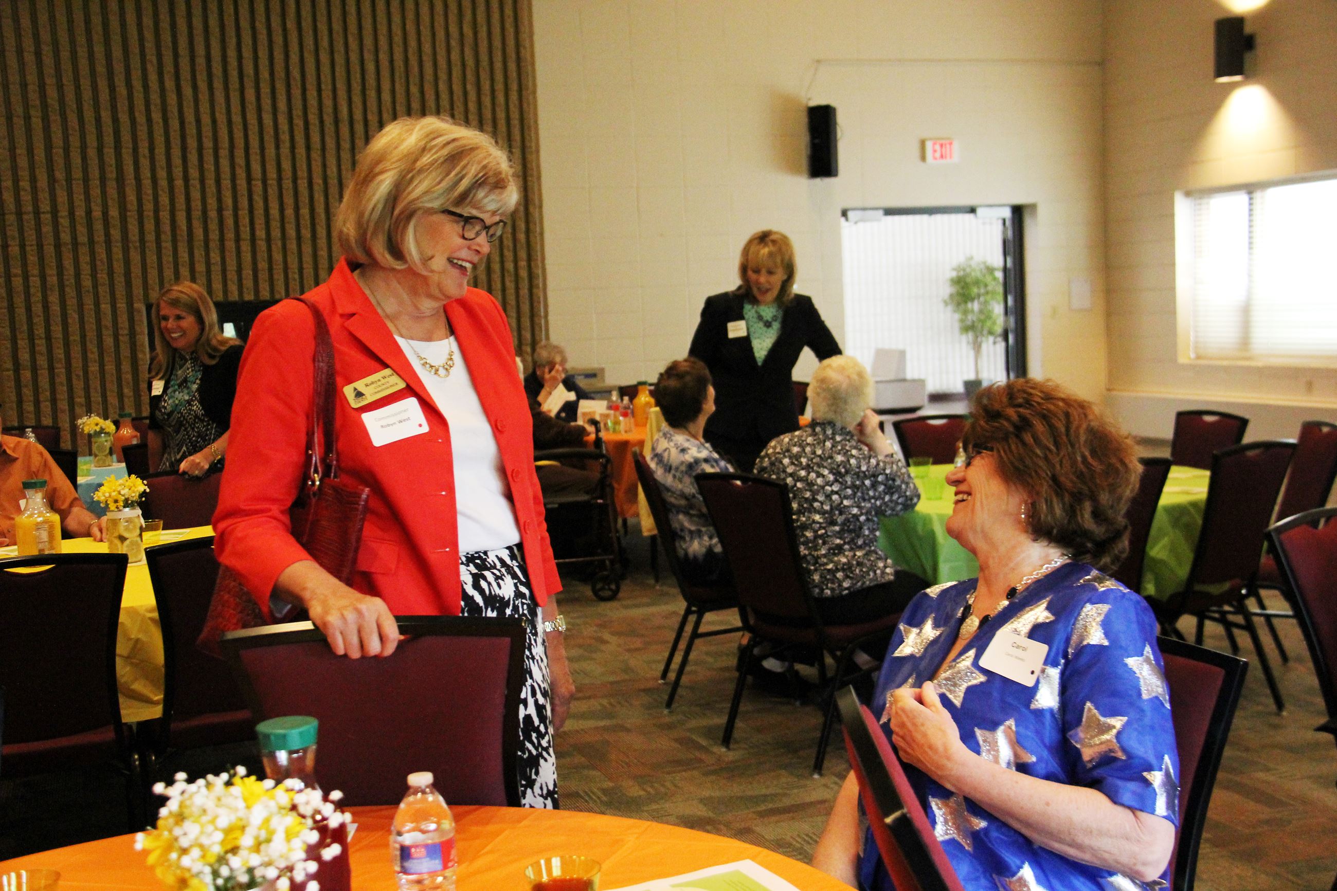 Commissioner Robyn West visits with RSVP event guest