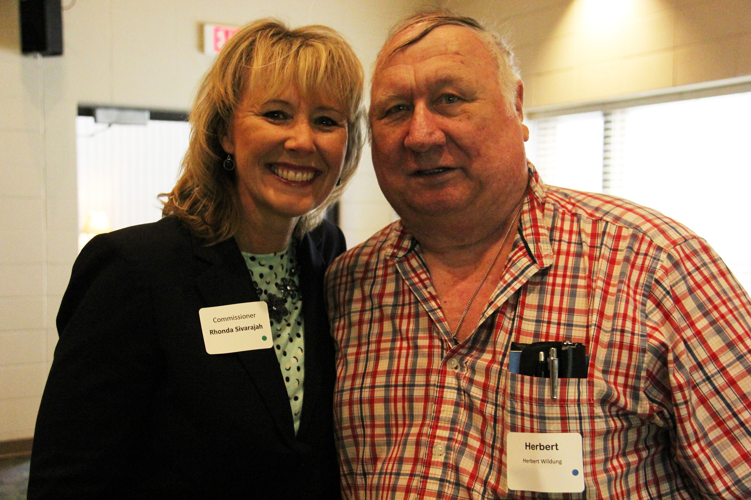 Commissioner Rhonda Sivarajah stands with RSVP event guest