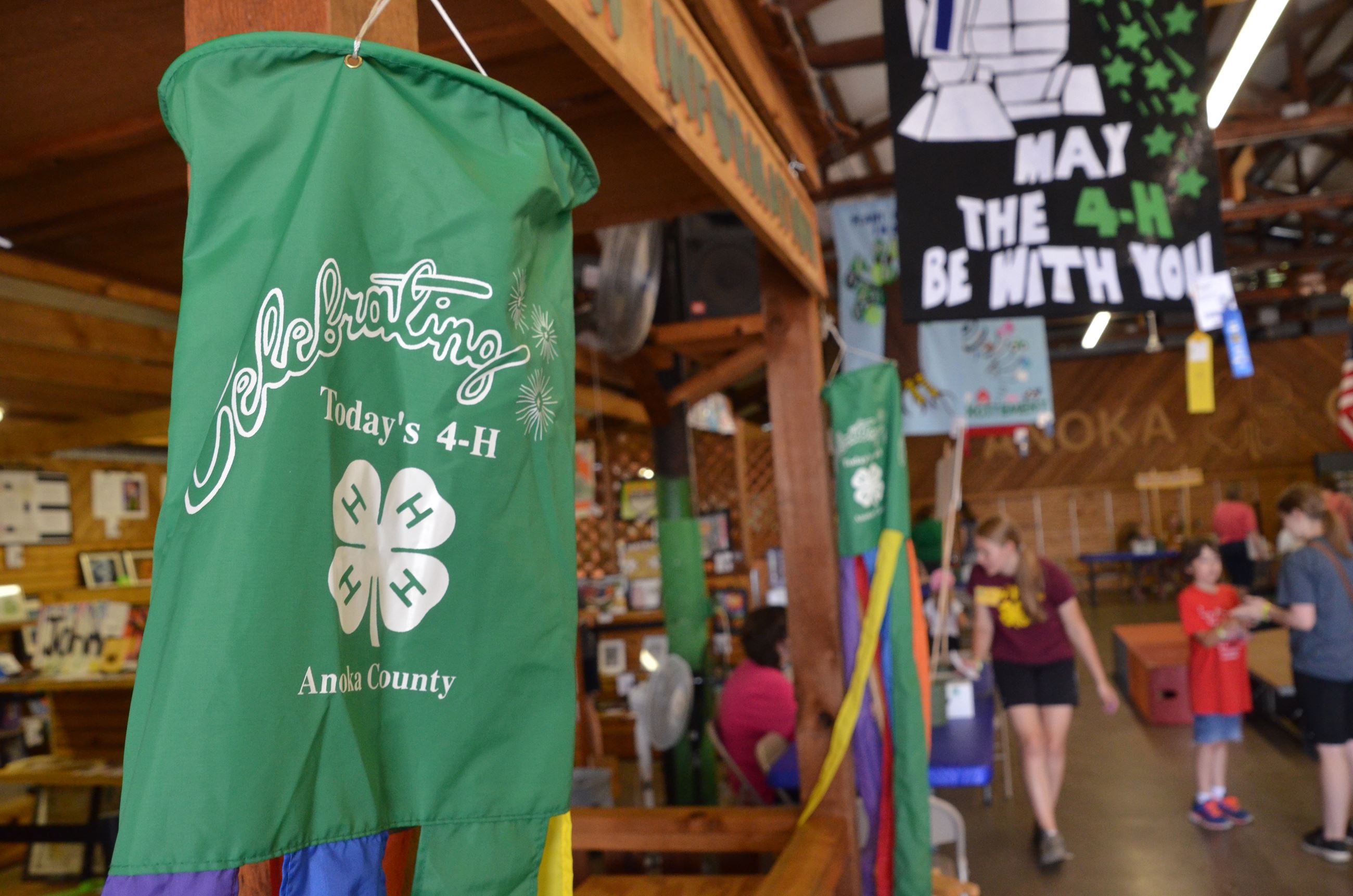 4-H flag with 4-H members and their projects