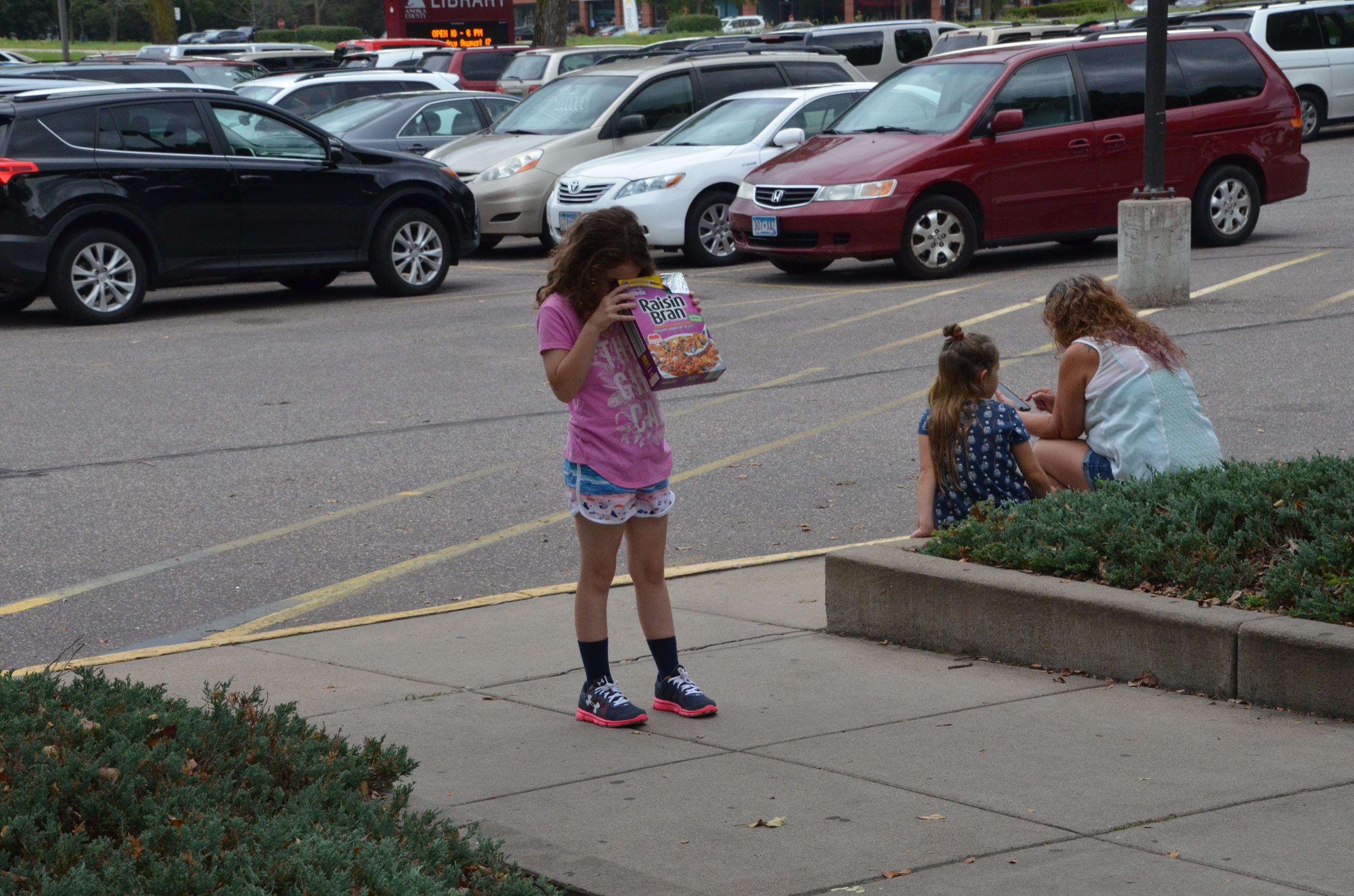 Child uses her new pin hole viewing box
