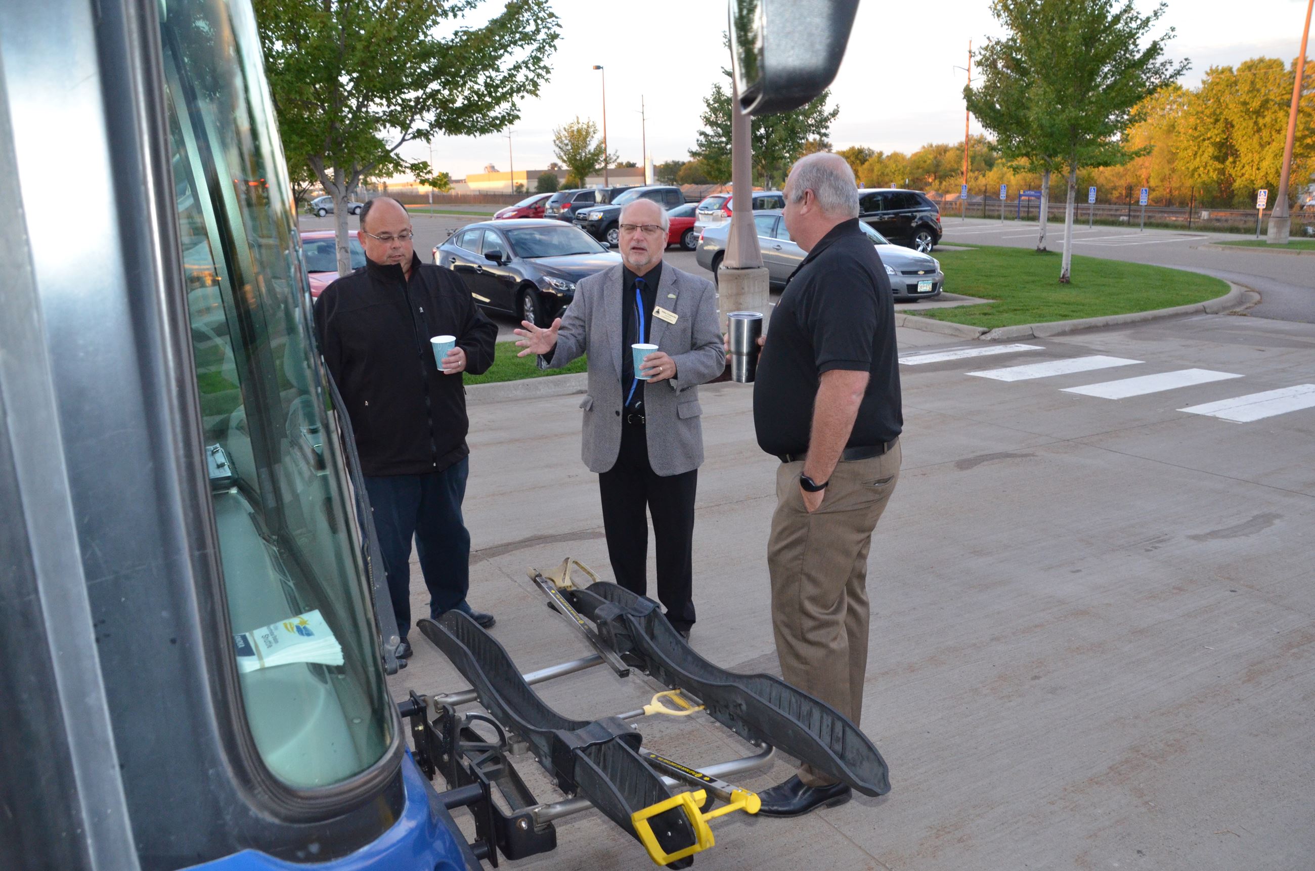 Commissioner Gamache is shown the bus' bike rack attachment