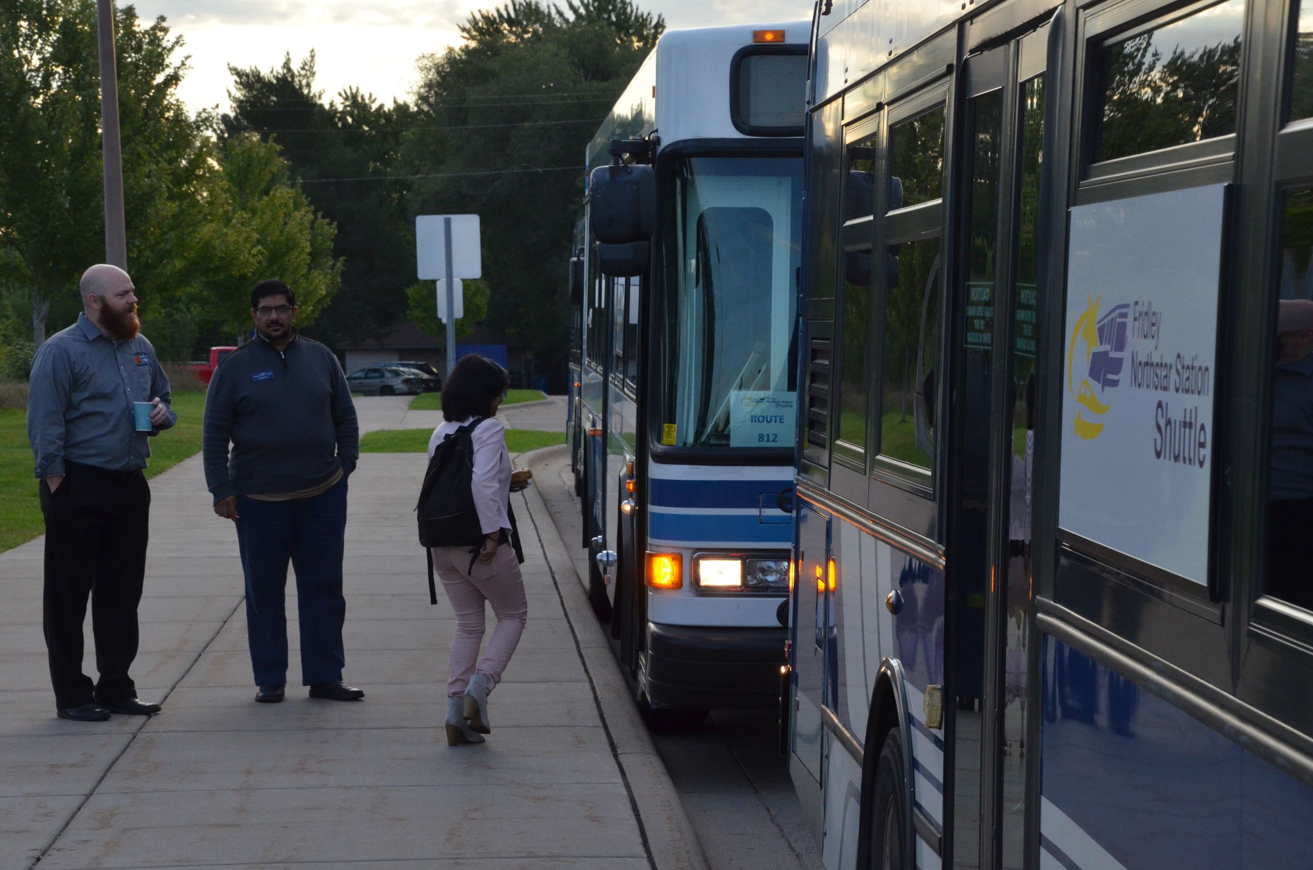 Riders are shuttled from the station to their work location