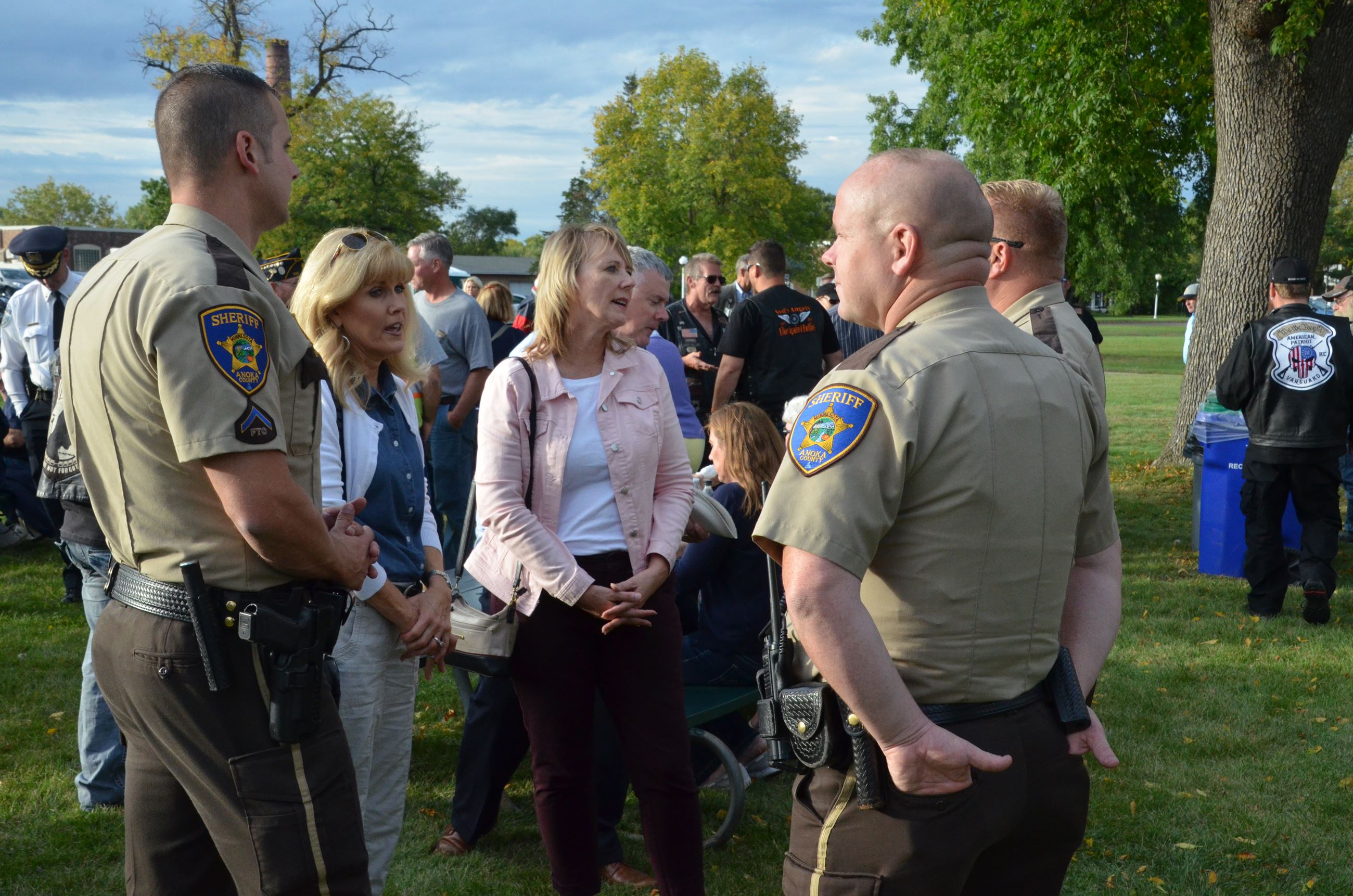Commissioner Sivarajah speaks with members of the Anoka County police