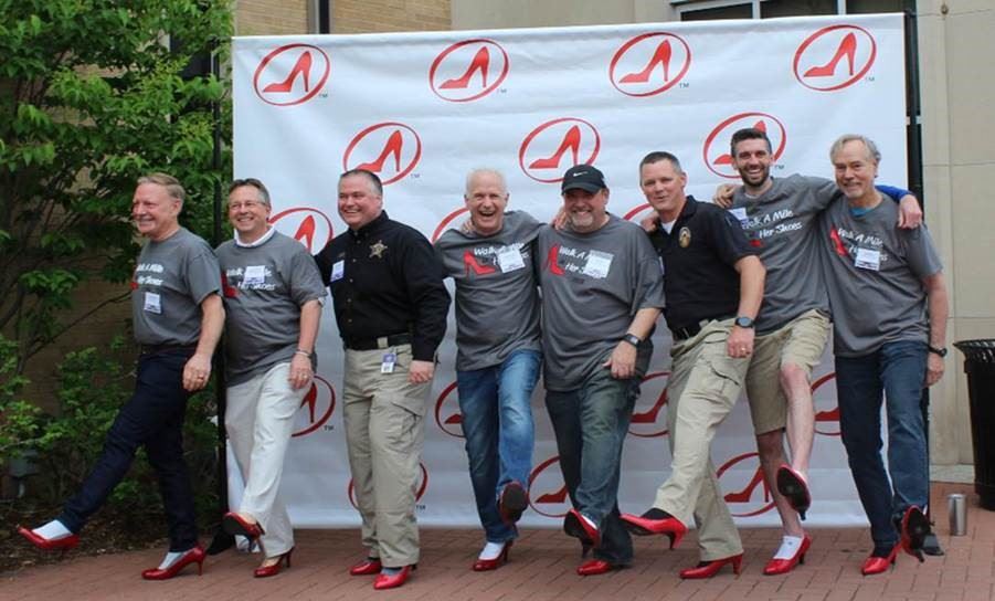 Comm. Schulte and organizers show off their red high heels