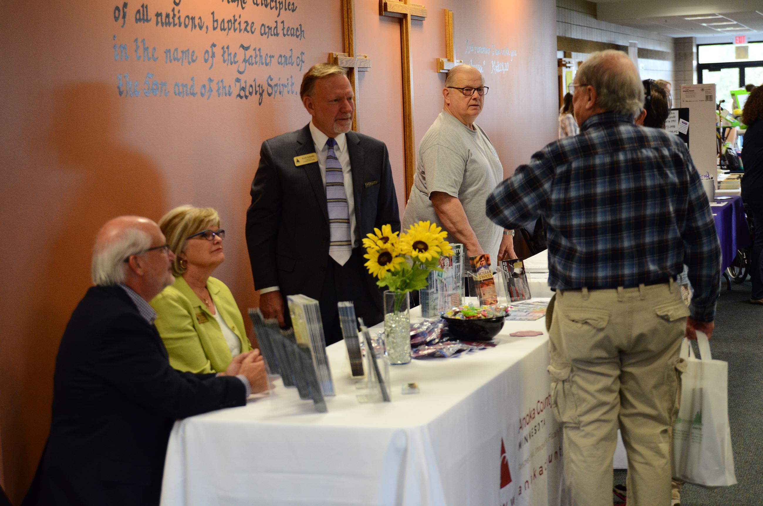 Comm. Gamache, Comm. West, and Comm. Schulte man the Anoka County display