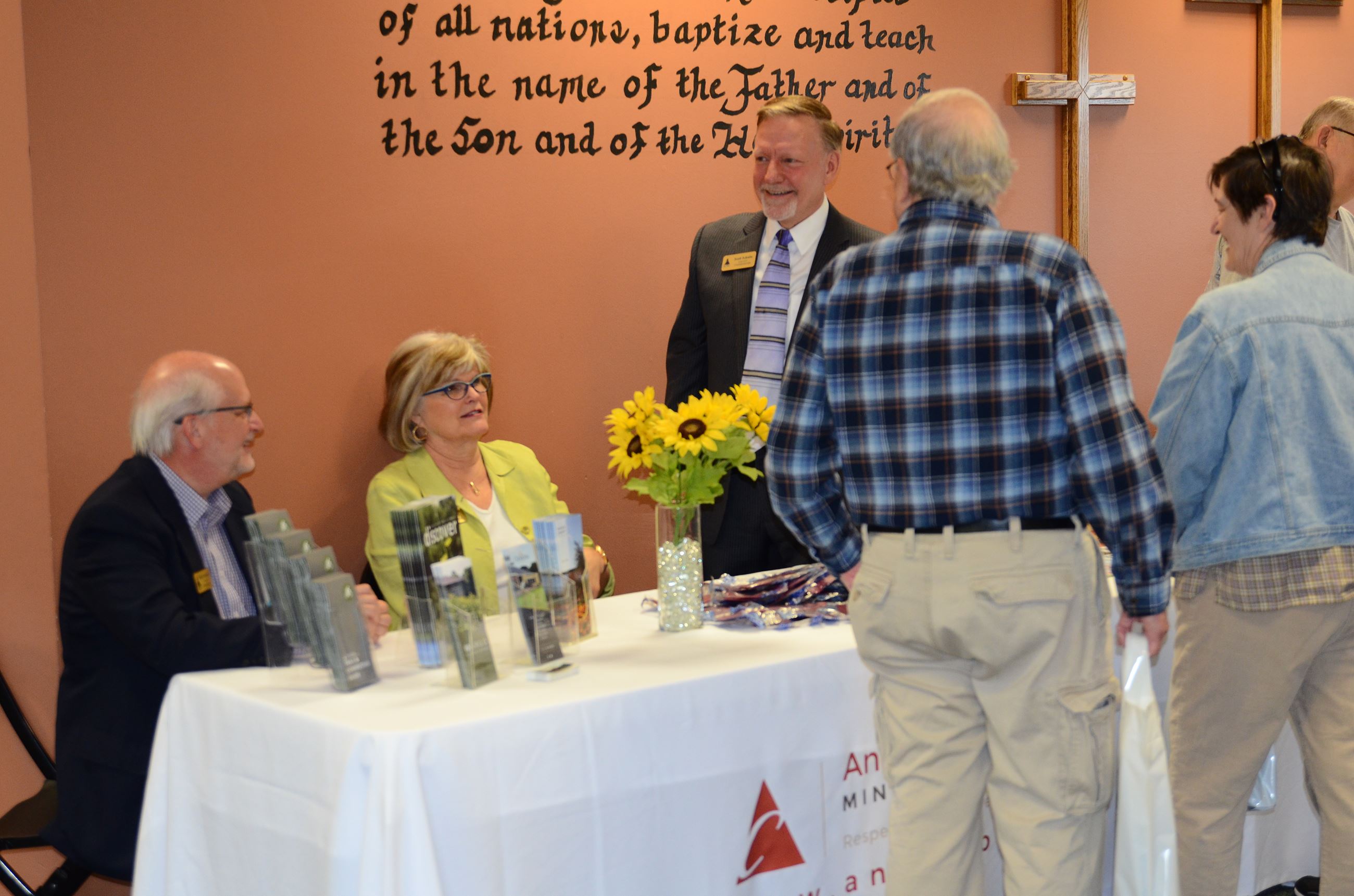 Comm. Gamache, Comm. West, and Comm. Schulte man the Anoka County display