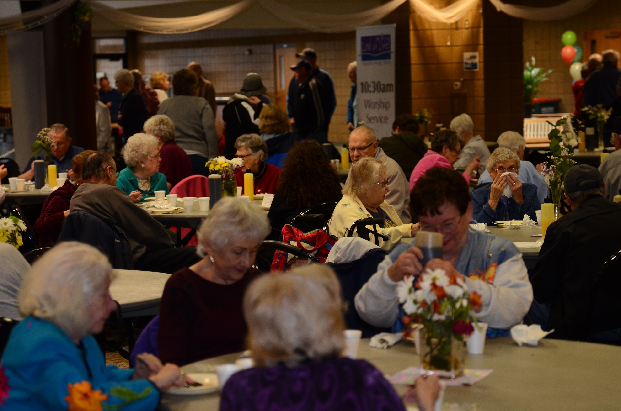 Visitors eat a meal served at the Senior Expo
