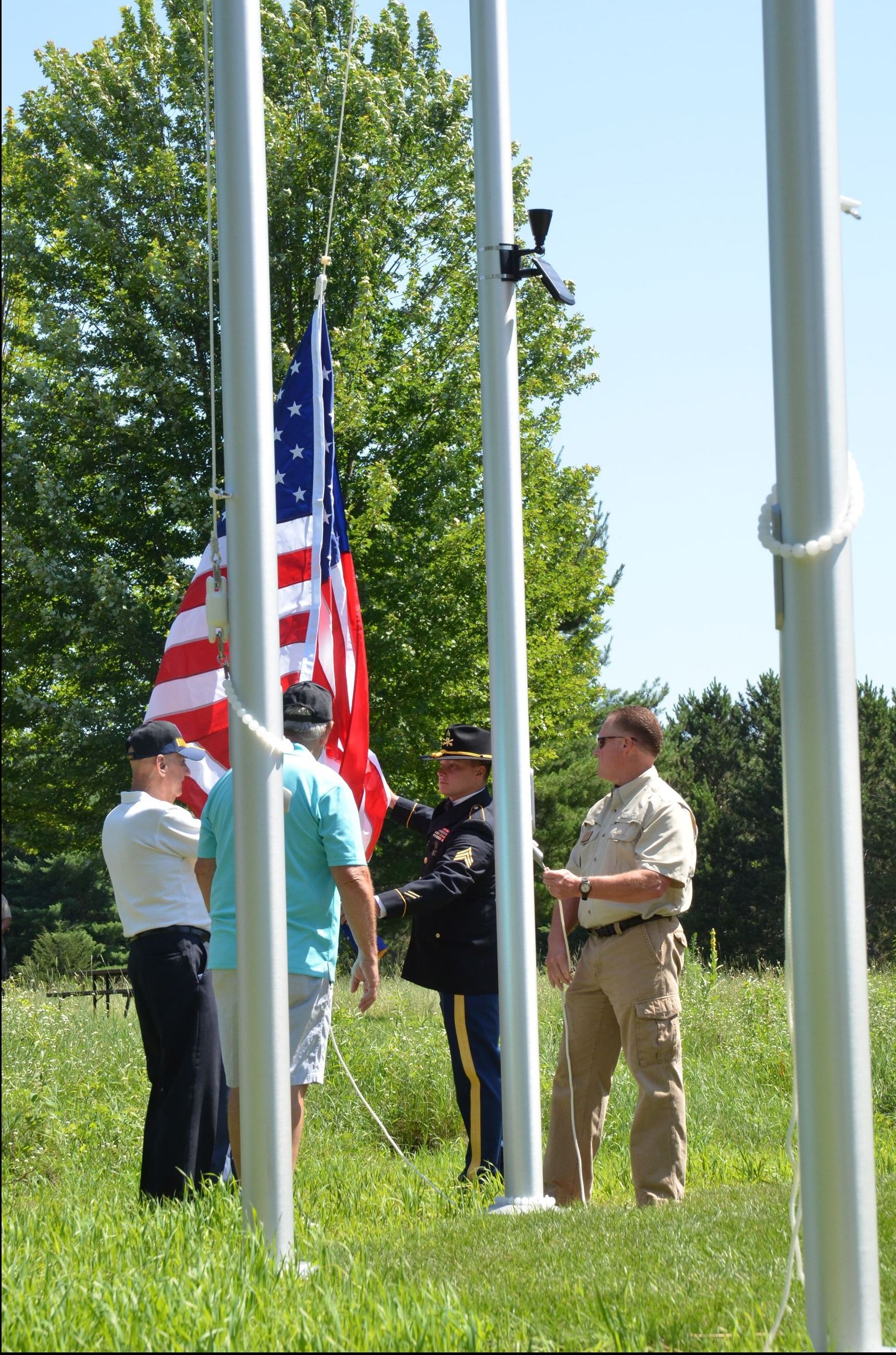 Veterans raise the flag