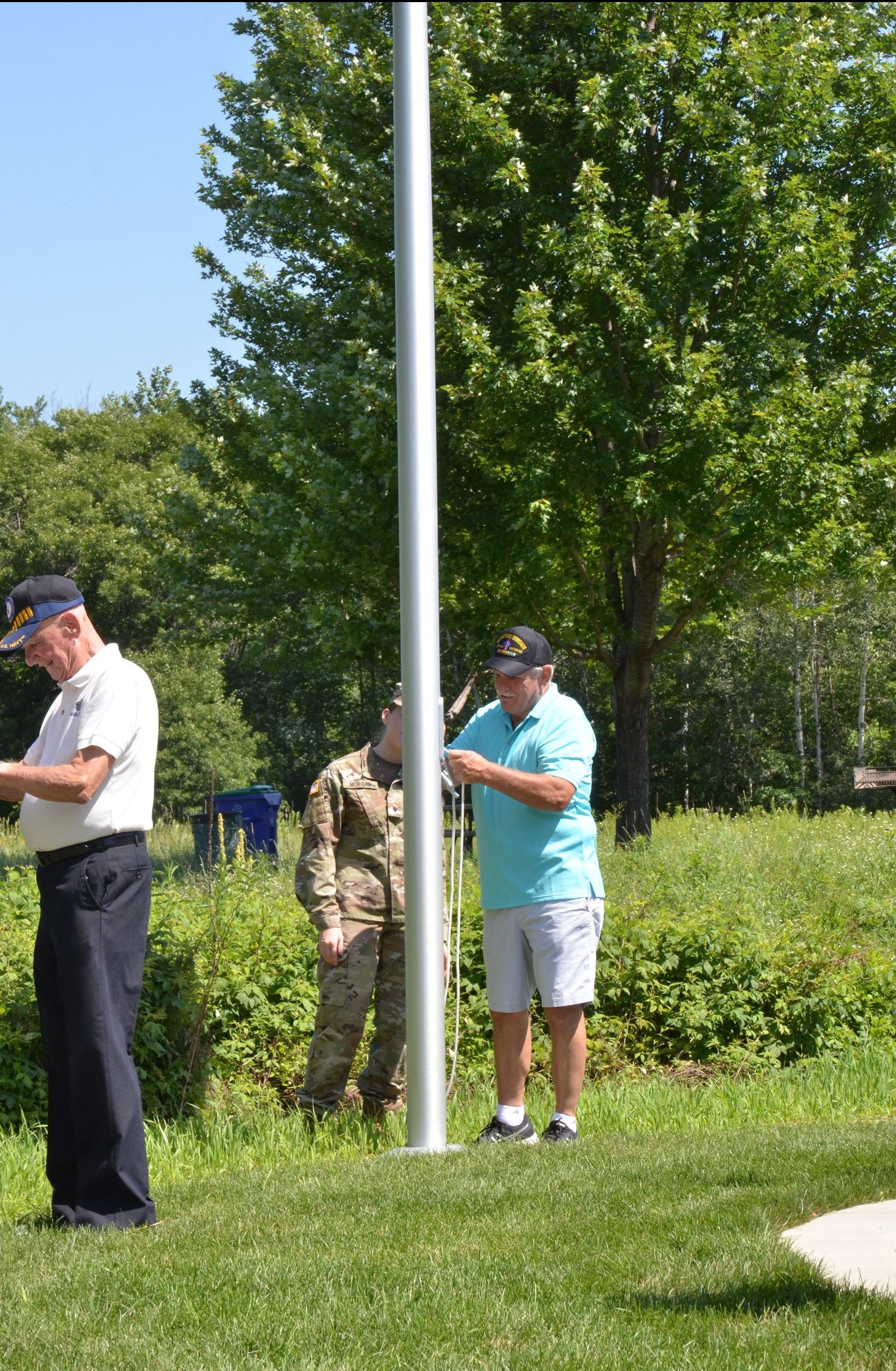 Veterans raise the flag