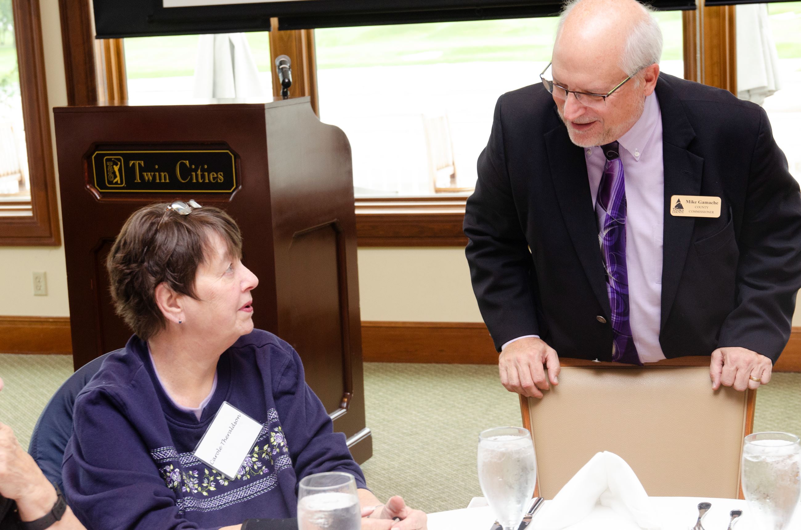 Gamache talking to volunteer 